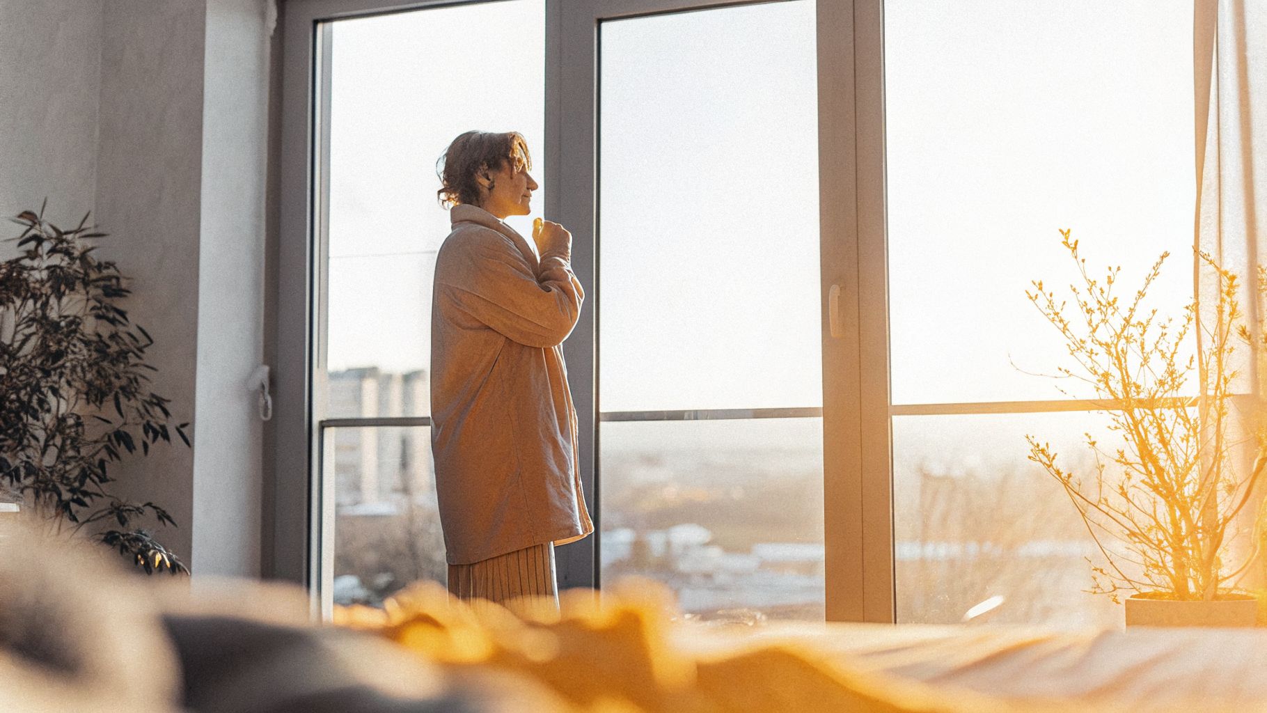 Awareness for change: person pausing by a window before reacting