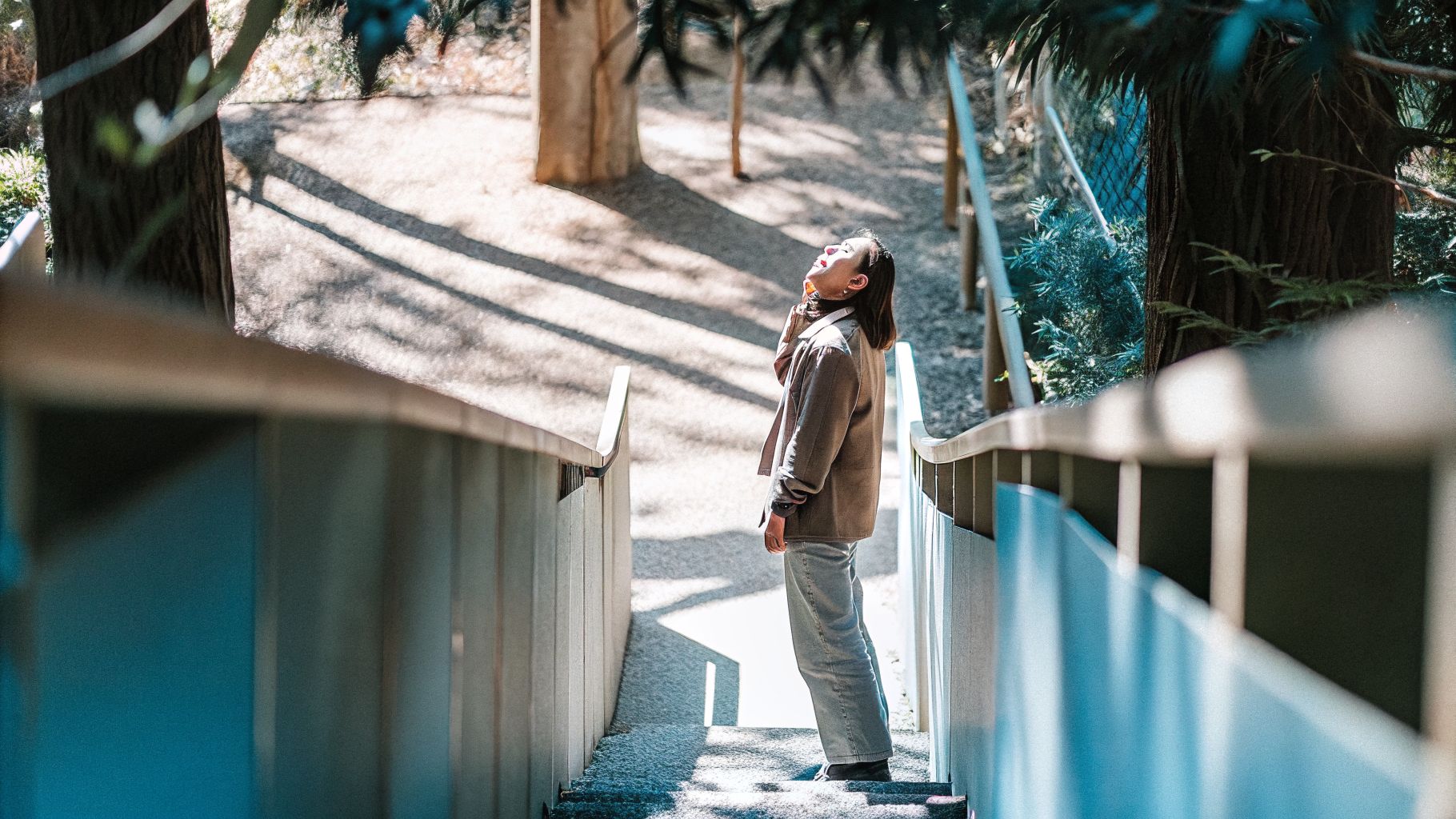 A person pausing mid-step in awareness and change, noticing their surroundings