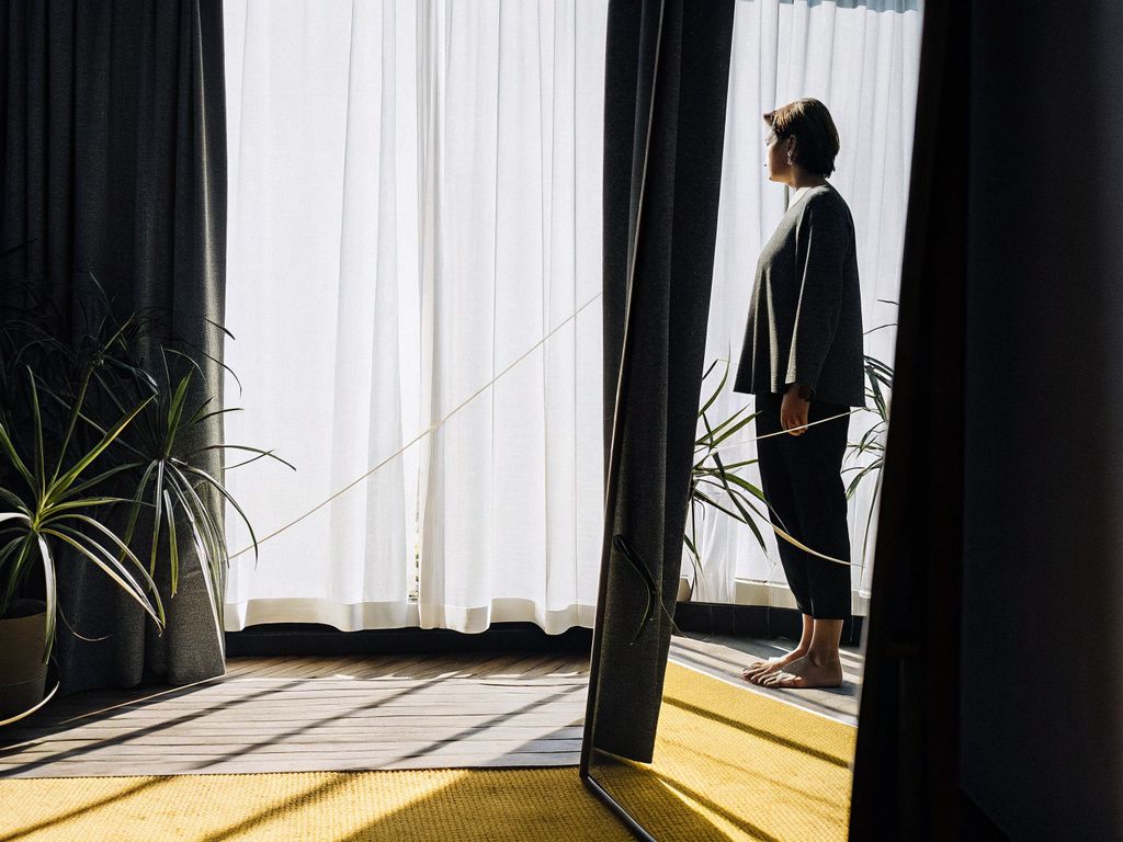 person looking into mirror