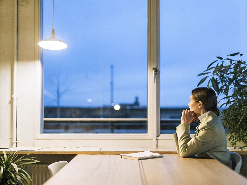 Leader alone in a dim office at night