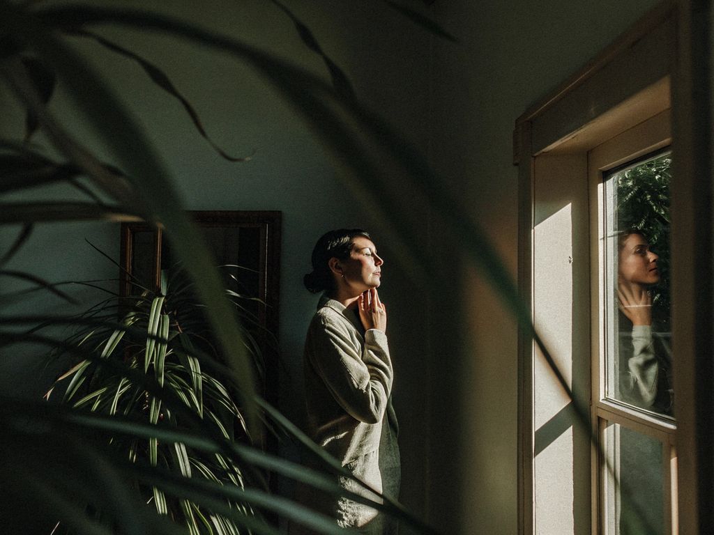 person pausing with thoughtful expression