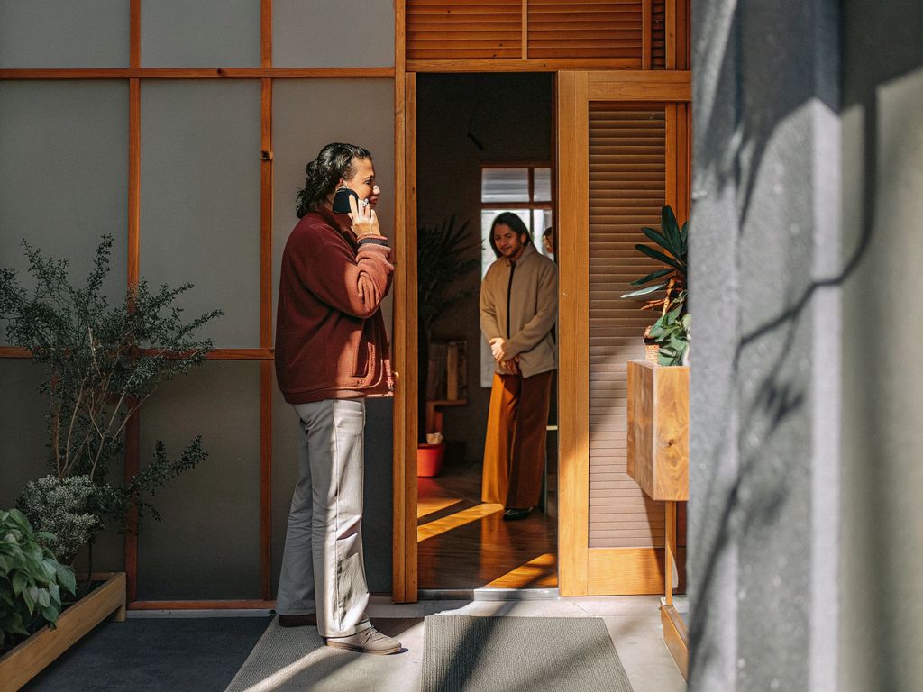 person pausing before a threshold