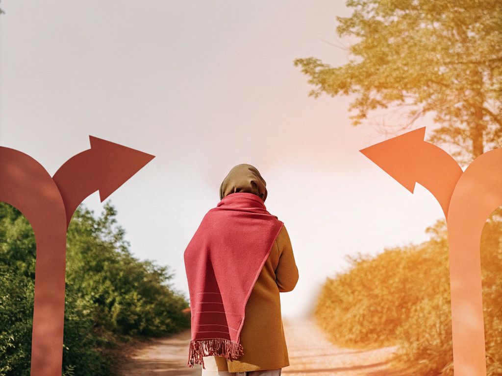 person wrestling with decision at a crossroads