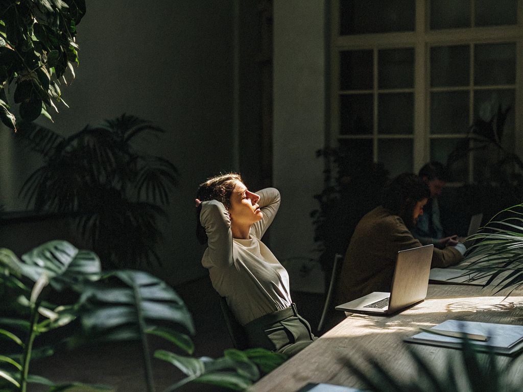 overwhelmed professional at desk