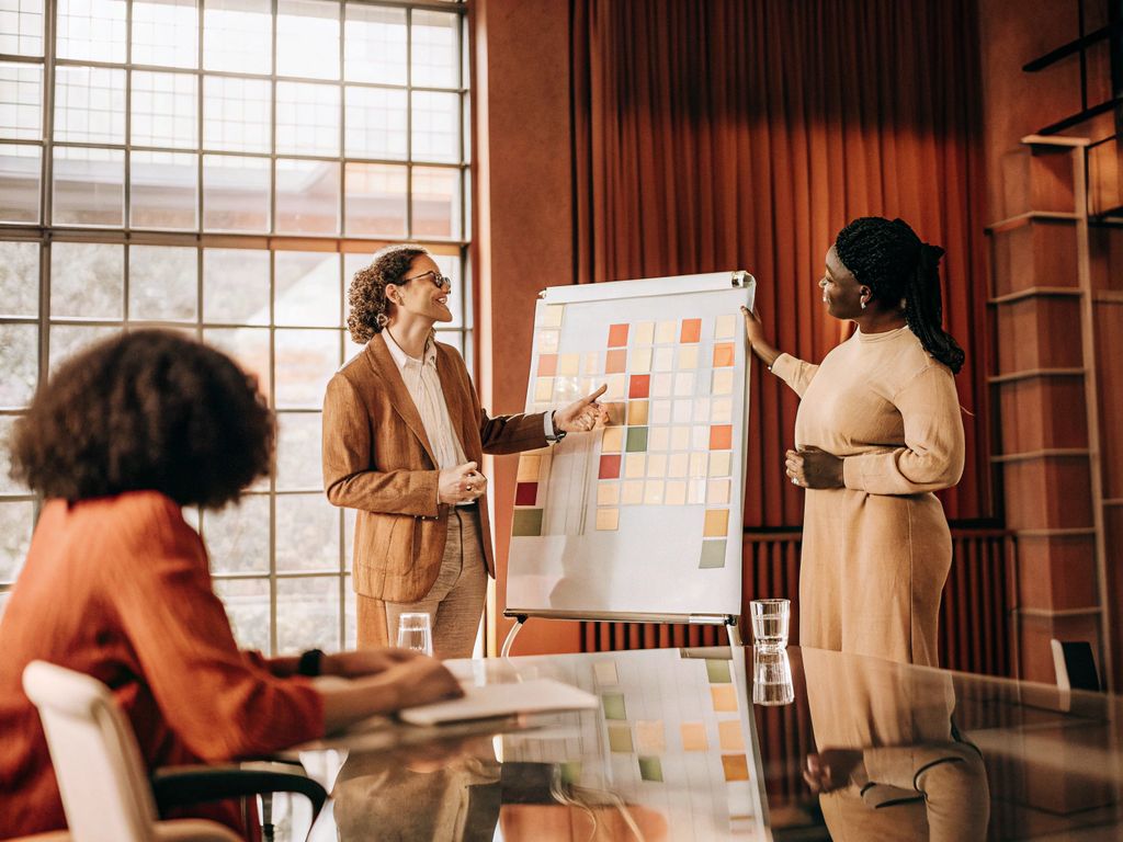 team in discussion with sticky notes
