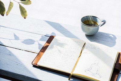 sunlit journal, tea, and mindful breathing sketch