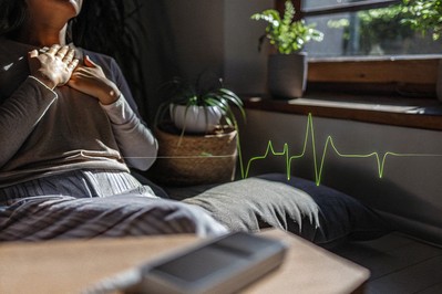 person practicing heart-focused breathing with HRV graph