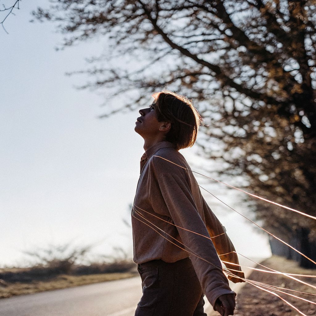 Person walking with inner alignment tug-of-war in their chest