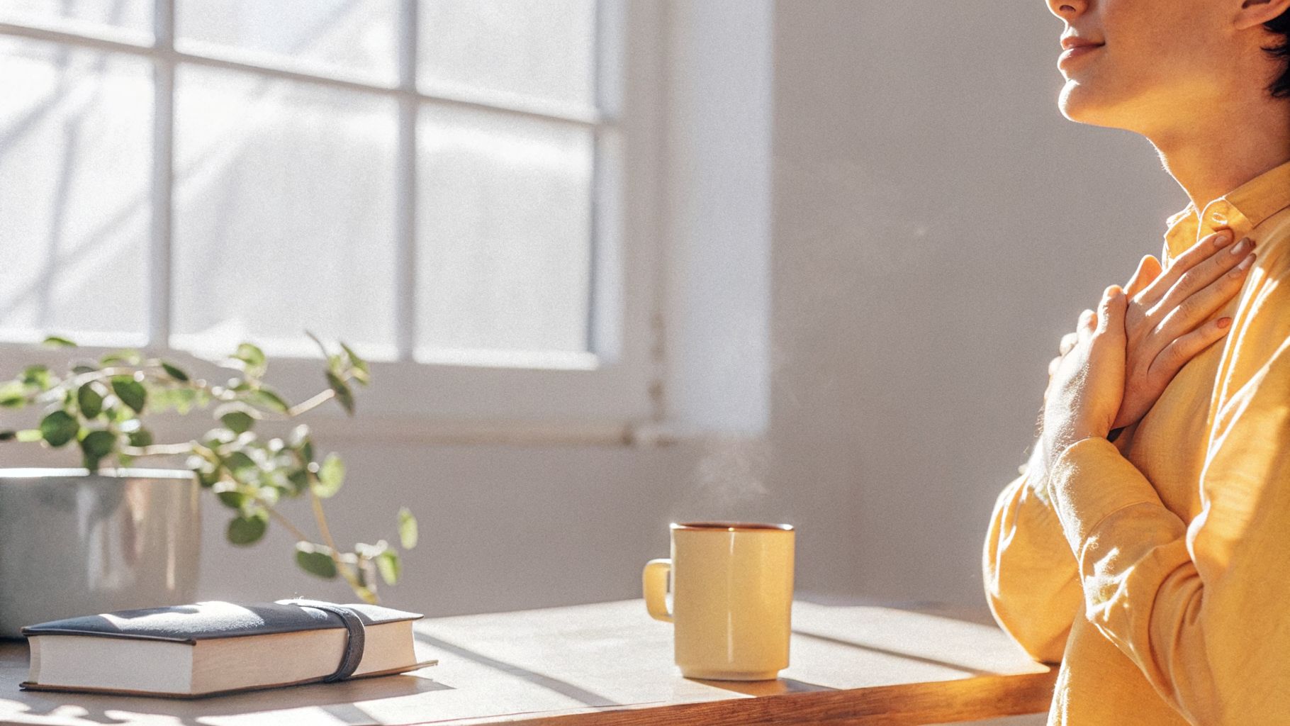 Person at a desk pausing anxious self-talk while rewiring inner narrative