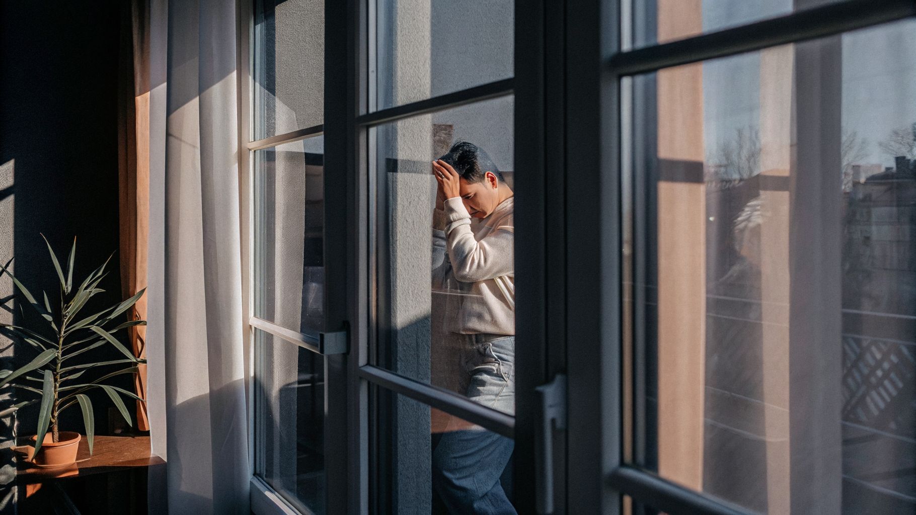 Person noticing unconscious emotional programming across repeated life situations